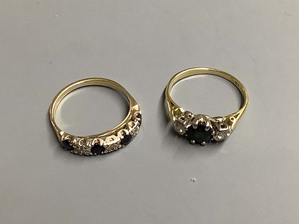 Two yellow metal, sapphire and diamond rings